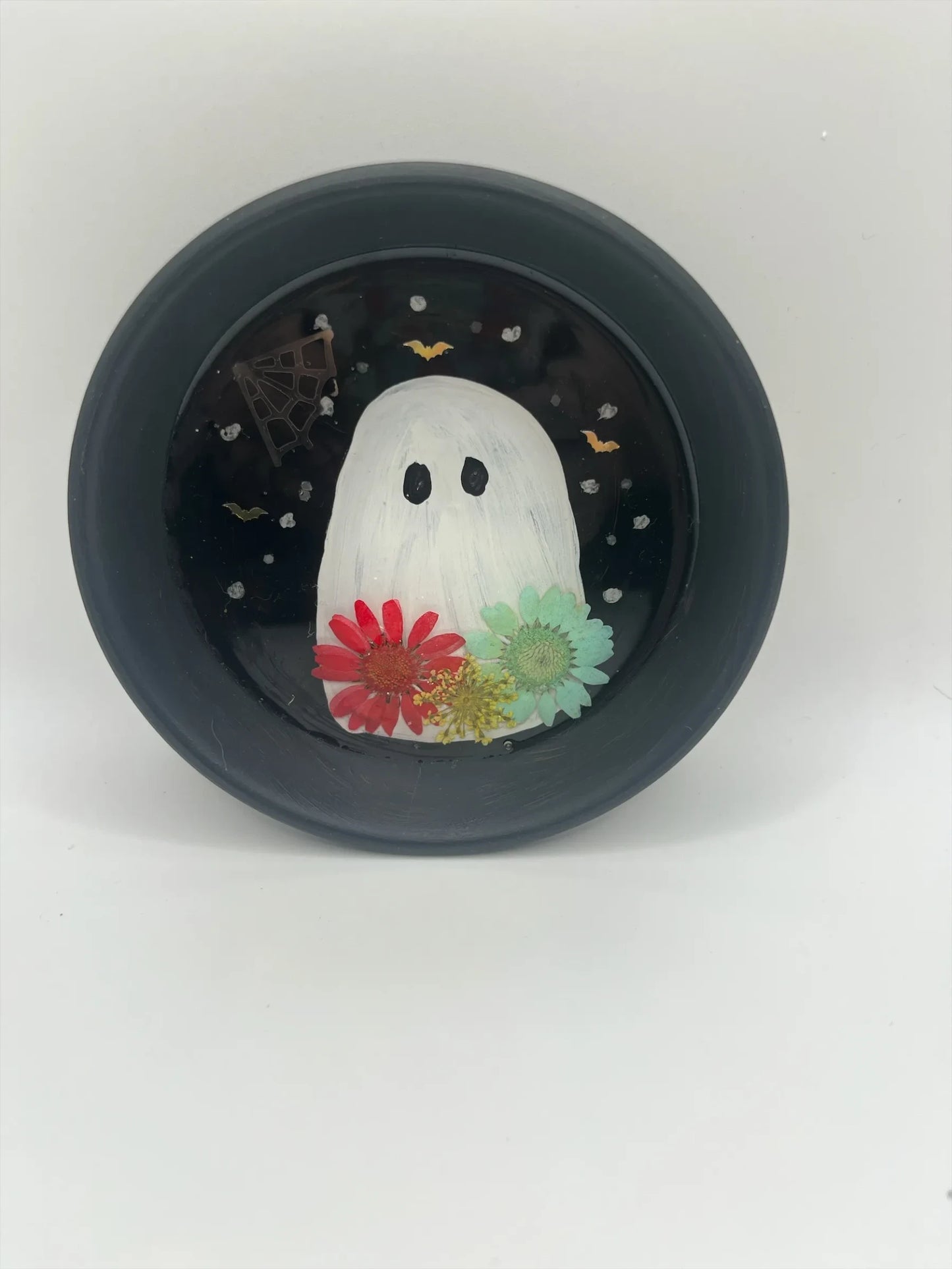 Helena’s Artisan & Gift Co. handmade resin ghost trinket dish with pressed flowers, spiderweb, and bats on black.