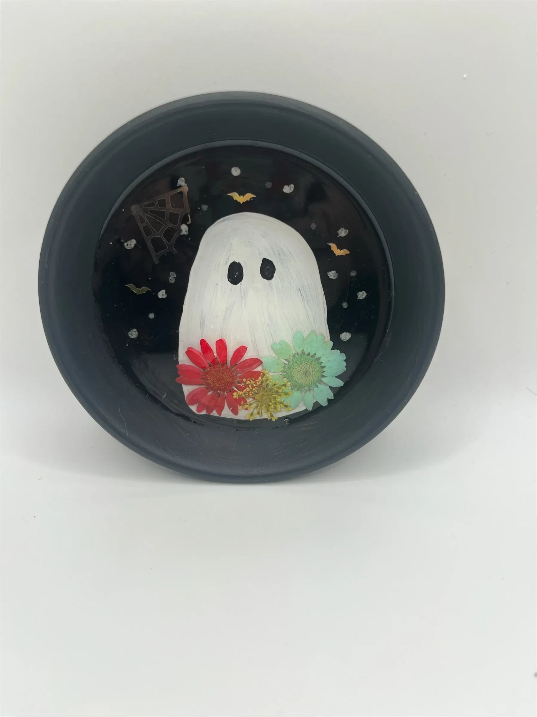 Helena’s Artisan & Gift Co. handmade resin ghost trinket dish with pressed flowers, spiderweb, and bats on black.